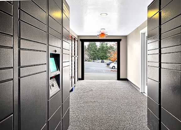 A long hallway with a view of the outside through a window.