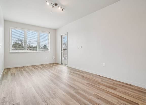 A room with a window and a door.
