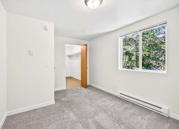 A room with a window and a door.