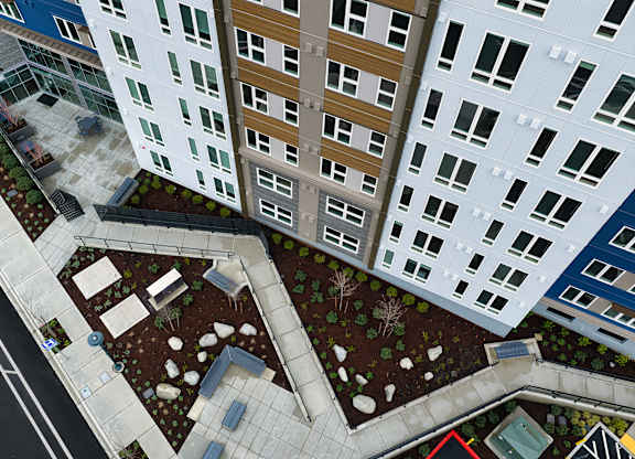 A view of a courtyard between two buildings.