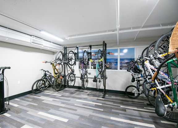 A bike rack with bicycles in a room.