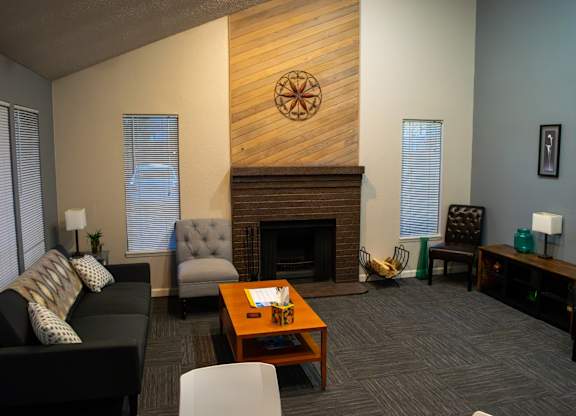 A living room with a fireplace and a couch.