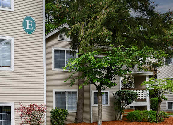 A building with a green letter E on the side.