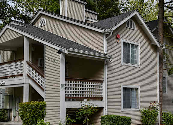 A house with a balcony and a window.