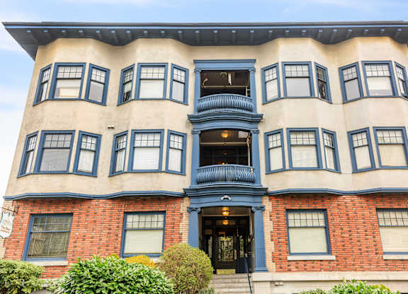 A large building with a blue door and windows.