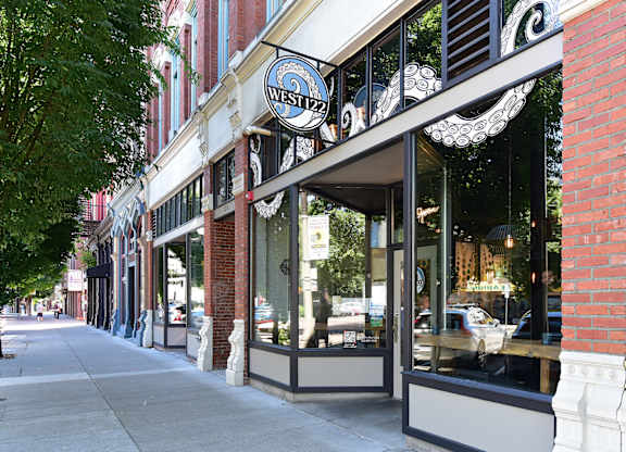 A storefront with a sign that says West 127.