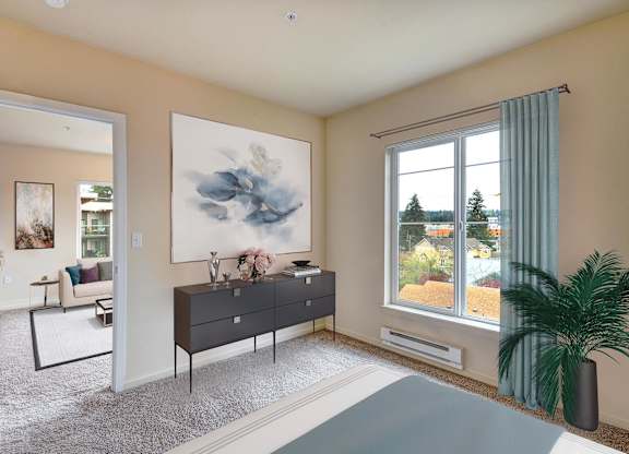 A living room with a large painting on the wall and a view of the outdoors through the window.