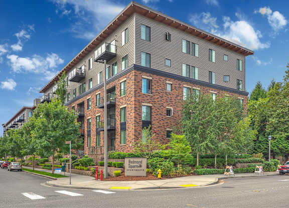 A multi-story building with a brick facade and a sign that reads "Bedford Park".
