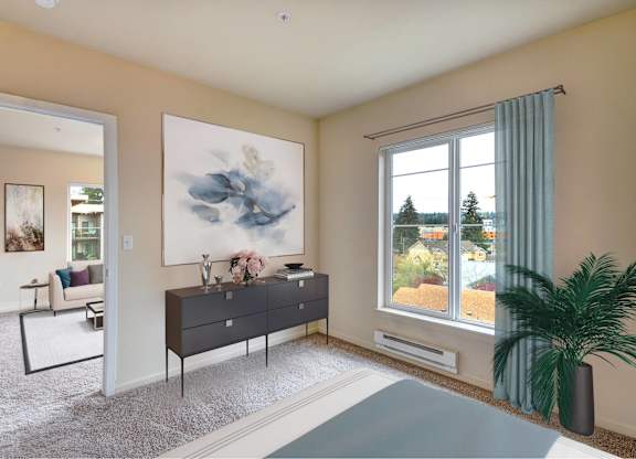 A room with a large painting on the wall and a view of trees outside the window.