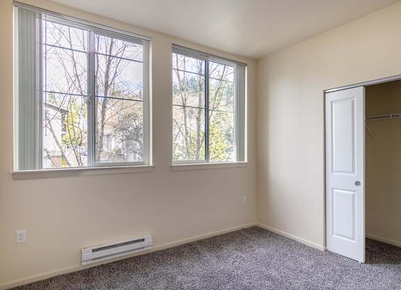 A room with a window and a door.