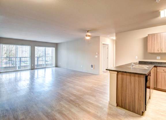 A kitchen with wooden cabinets and a countertop is shown.