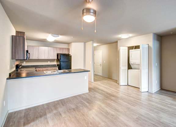 A kitchen with a counter and cabinets is shown.
