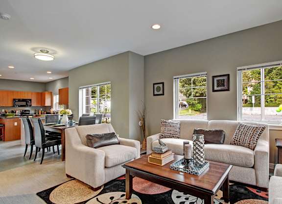 A living room with a couch, chair, and coffee table.