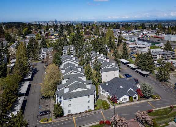 A suburban area with a mix of residential and commercial buildings.