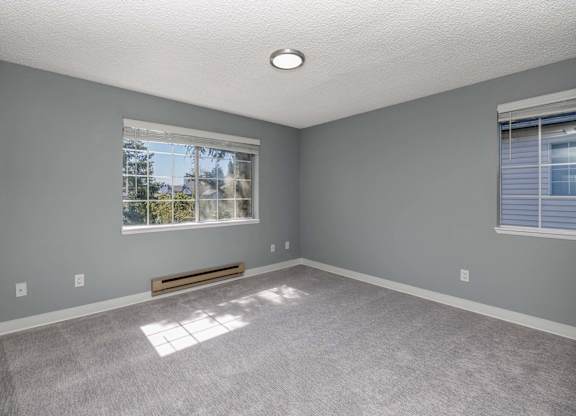 A room with a window and a bench.