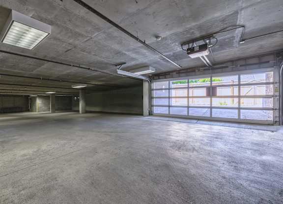 A large, empty warehouse with concrete floors and walls.