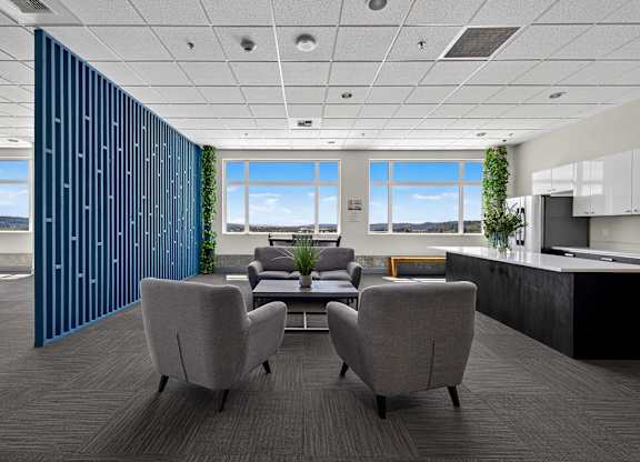 A modern office with a view of the mountains.