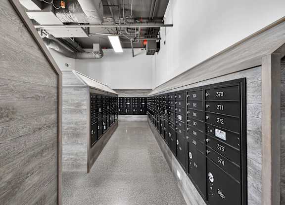 A long hallway with a series of lockers on the right side.