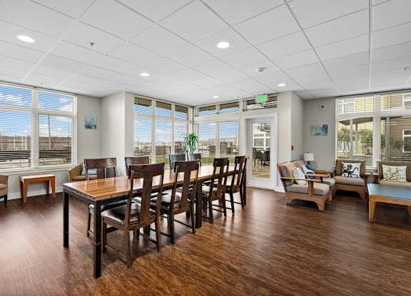 A room with wooden floors and furniture.