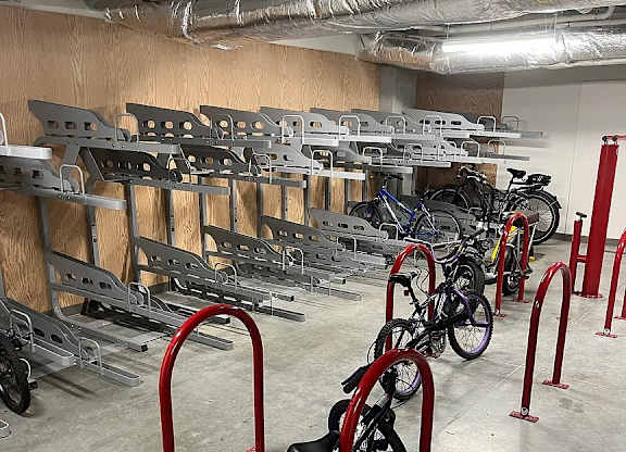 A bike is parked in a bike rack.