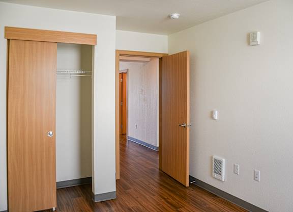 A hallway with two doors on either side.