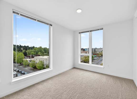 Bedroom with large windows at Victory Northgate Apartments, Washington, 98125
