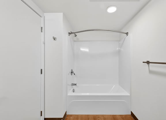 Bathroom with a tub and shower at Victory Northgate Apartments, Washington, 98125