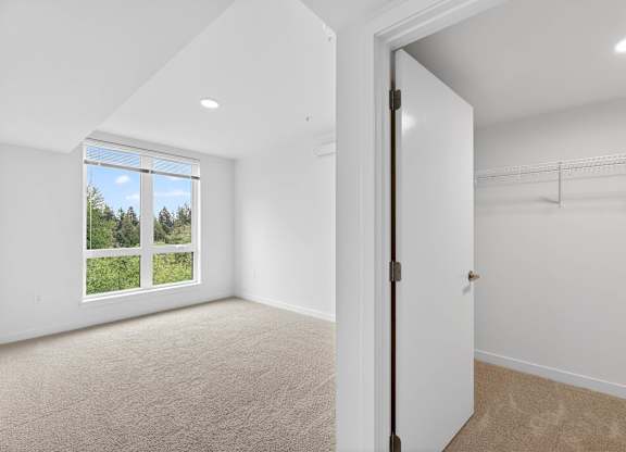 Bedroom area with closet view at Victory Northgate Apartments, Seattle, WA, 98125