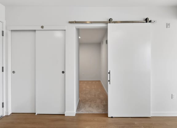 View of the living room with an attached hallway at Victory Northgate Apartments, Seattle, 98125