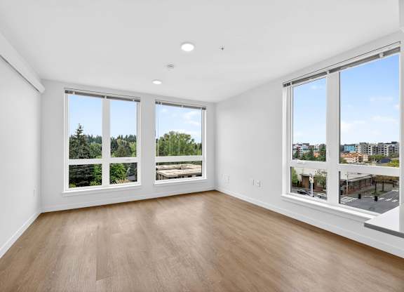 Living room area with plenty of natural light at Victory Northgate Apartments, Washington, 98125