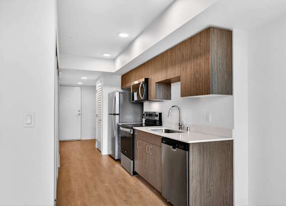Spacious kitchen area with white walls at Victory Northgate Apartments, Seattle, WA, 98125