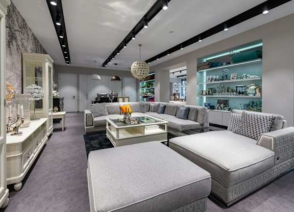 A modern furniture store with a variety of seating options.
