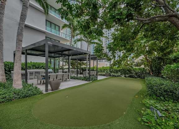A green lawn area in front of a building.