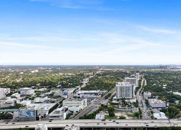 A cityscape with a clear blue sky above.
