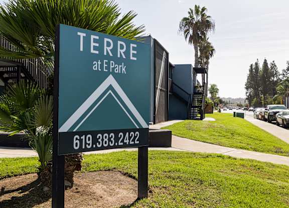 A sign for Terra at E Park with a phone number on it.