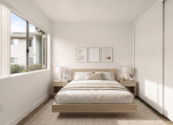 A bedroom with a bed, nightstands, and pictures on the wall.