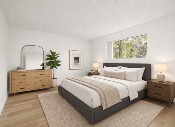 A bedroom with a large bed, a dresser, and a mirror.