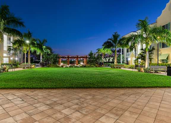 A large building with a lawn in front of it.
