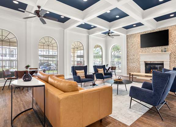 A living room with a fireplace and a television.