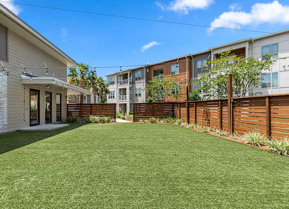 A sunny day at a residential area with a well-maintained lawn.