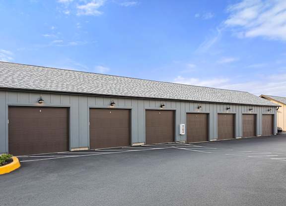 A long building with a row of garage doors.