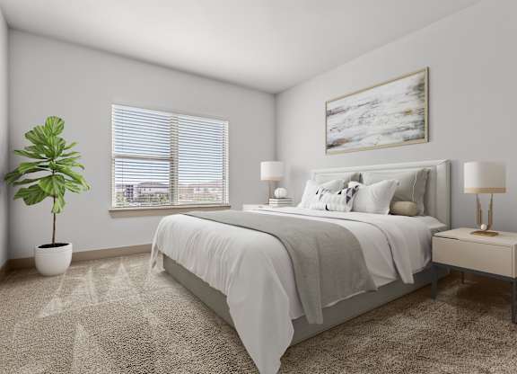 A bedroom with a bed, nightstand, and a plant.