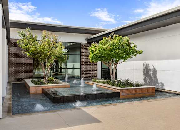 A modern house with a pool in the backyard.