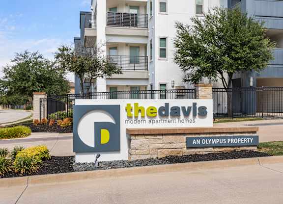 The Davis sign is in front of a building.