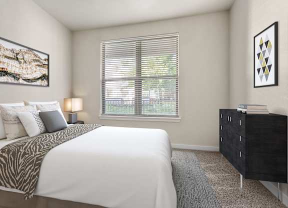 A bedroom with a large bed and a dresser.