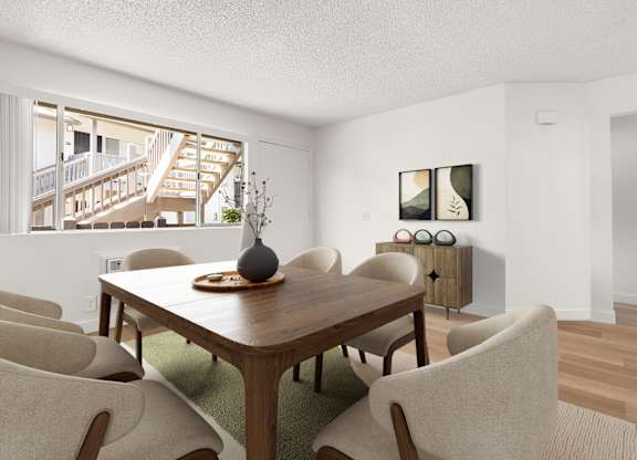 A dining room with a wooden table and chairs.