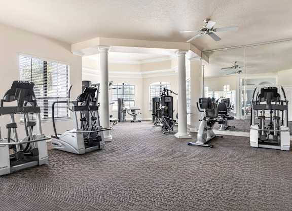 A spacious gym with a variety of exercise equipment.