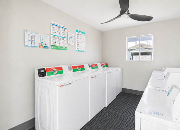 A row of washing machines in a laundromat.