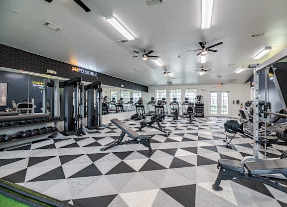 A gym with a black and white checkered floor.