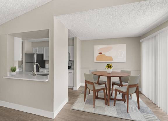 A kitchen with a dining table and chairs.